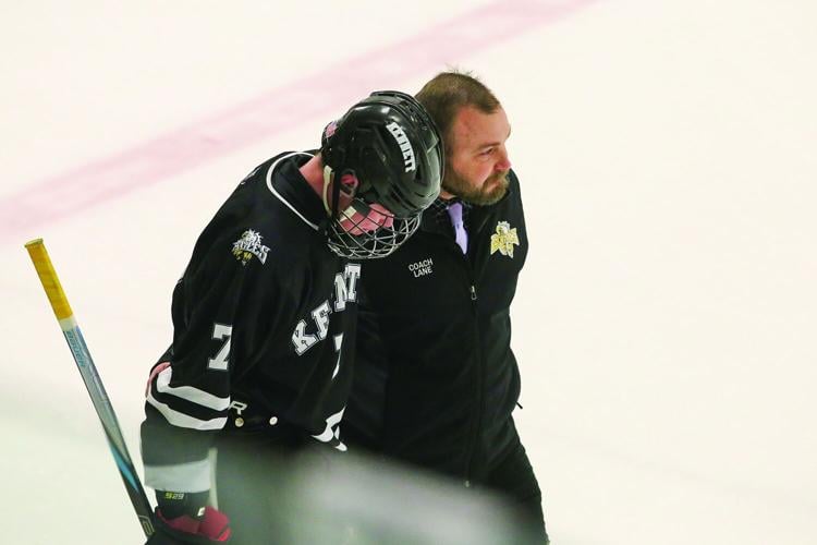03-11-26 KHS-BG Frozen Four coach and son