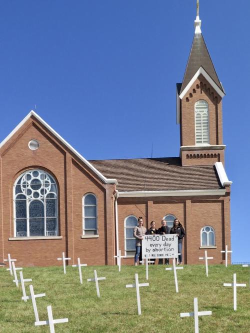 Students place crosses for National Right to Life month