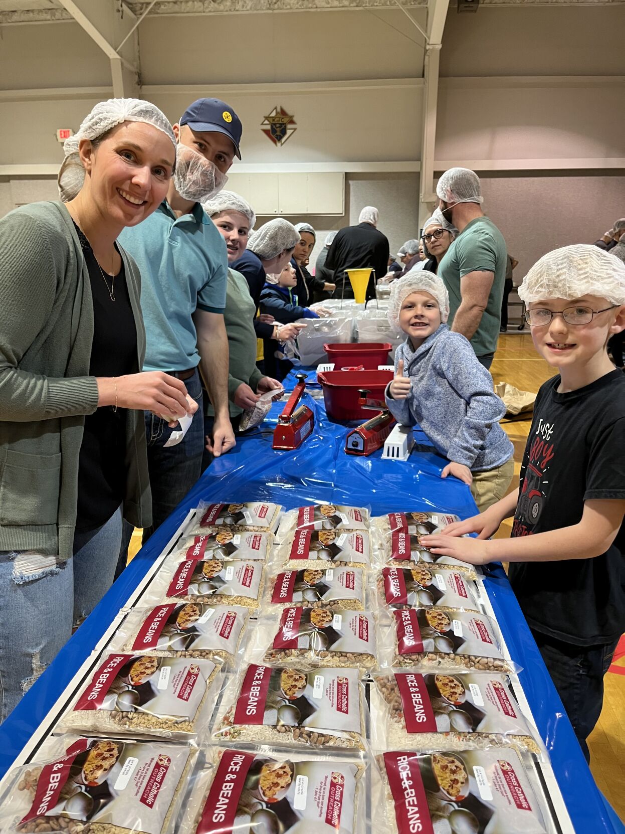 Area Catholic Churches Unite To Package Meals For People In Need ...