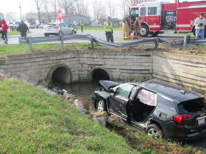 Vehicle, struck by car, flips over guardrail into ditch | Local News ...