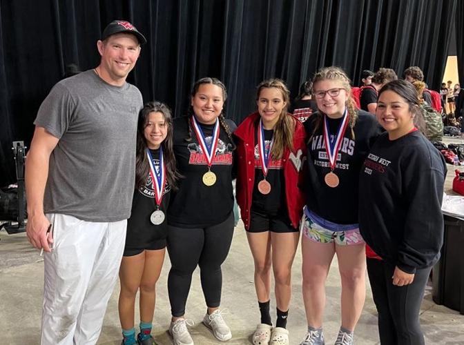 West powerlifters pose with coach and medals