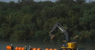 U S seeks court order requiring Texas to remove floating barrier in