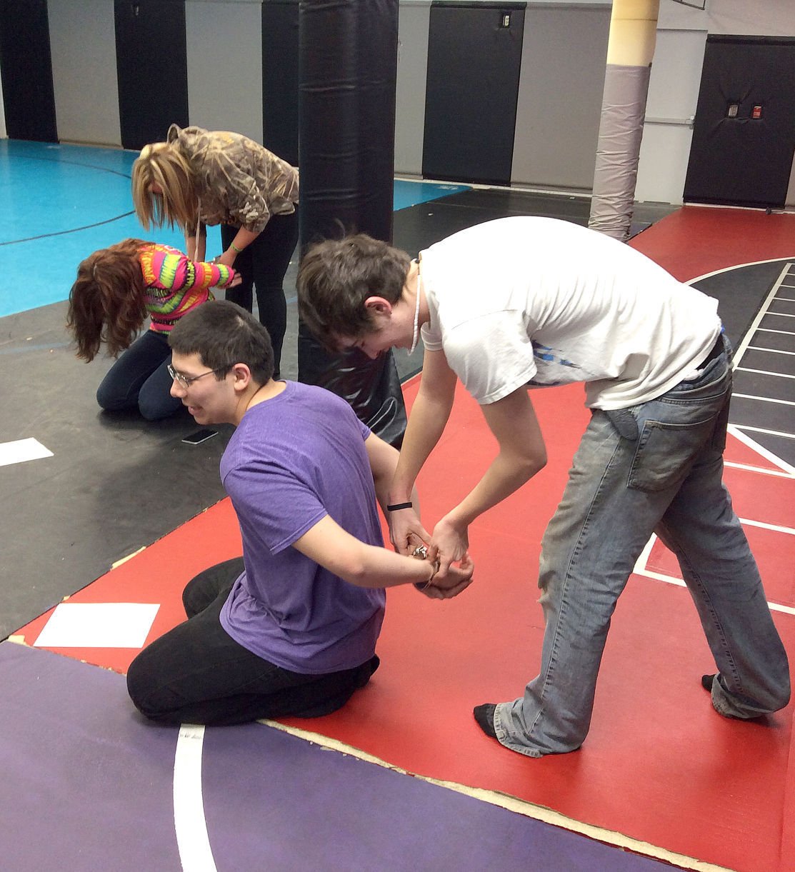 No ordinary lesson ACGC students practice putting on handcuffs Local