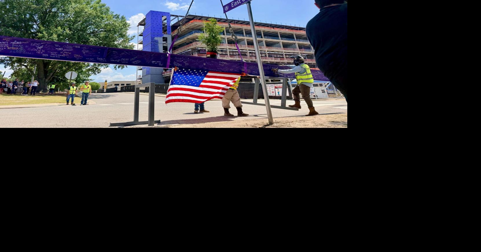 Topping ceremony celebrates construction milestone for new medical education center