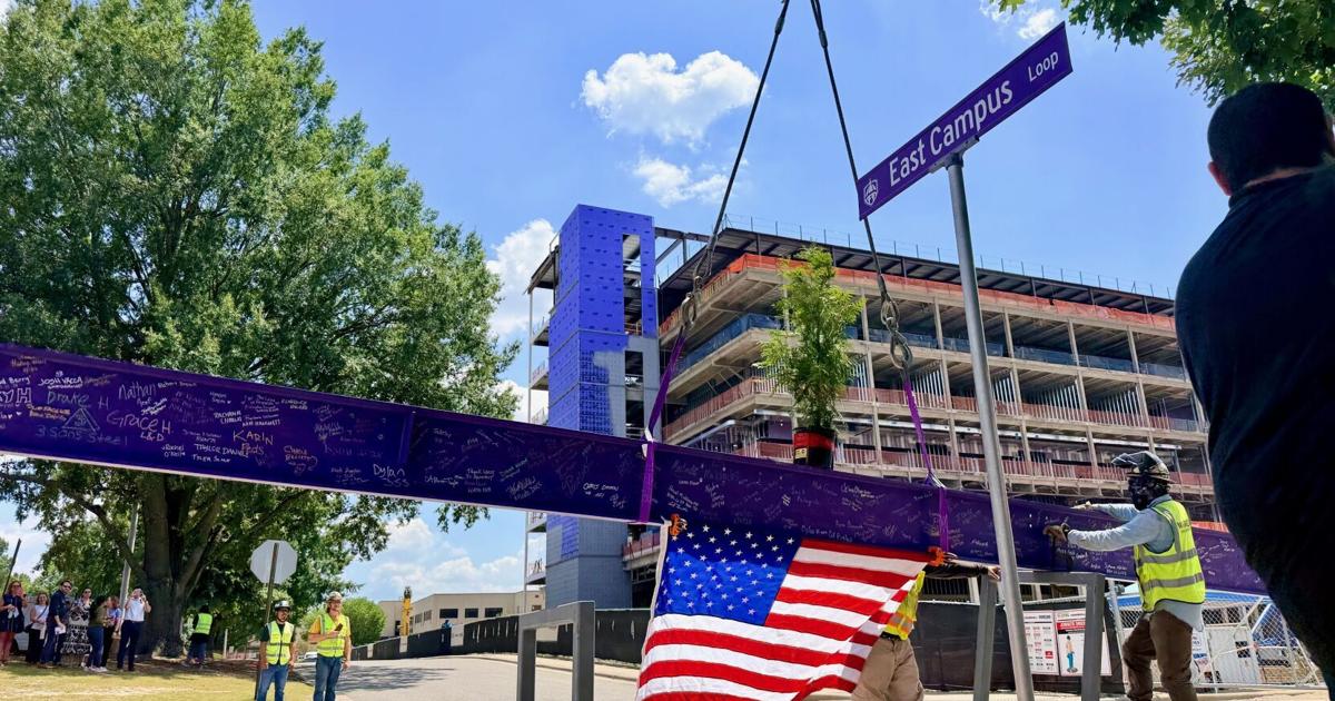 Topping ceremony celebrates construction milestone for new medical education center