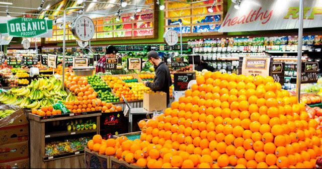 The fresh produce aisle of a Schnucks grocery store with colorful fresh  fruits and vegetables ready to be purchased by consumers. Photos