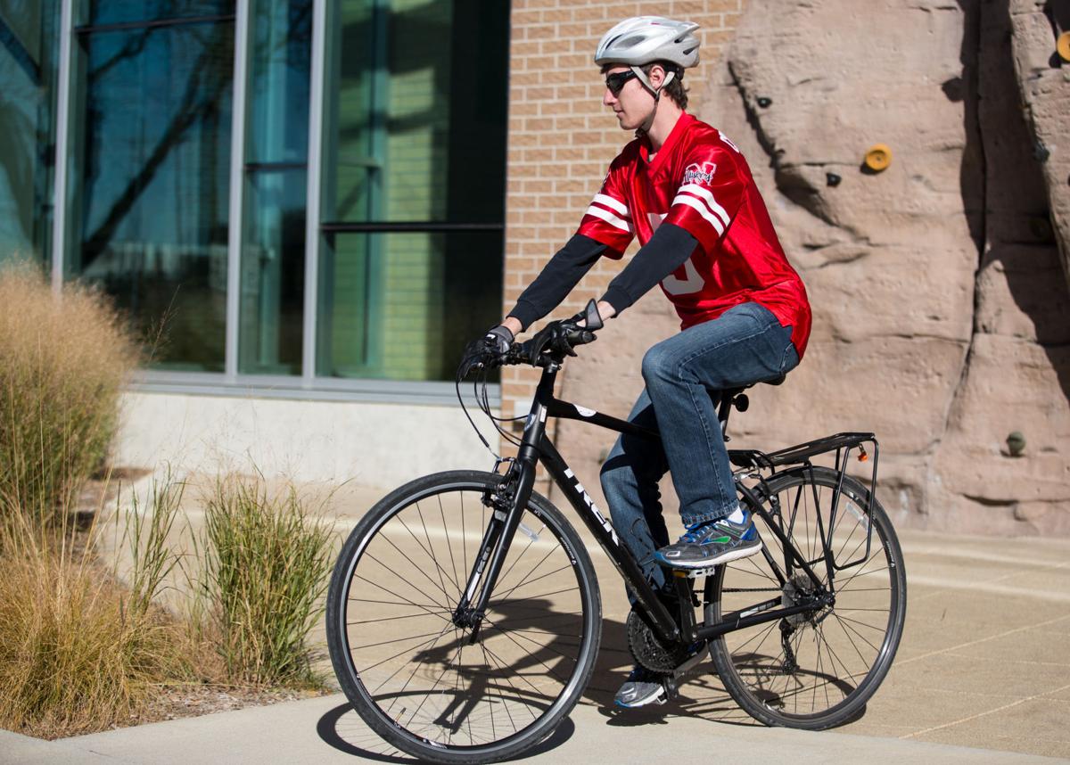 kennedy krikac rides his bike for the annual halloween costume bike ride presented by bike unl outside the outdoor adventures center in lincoln nebraska