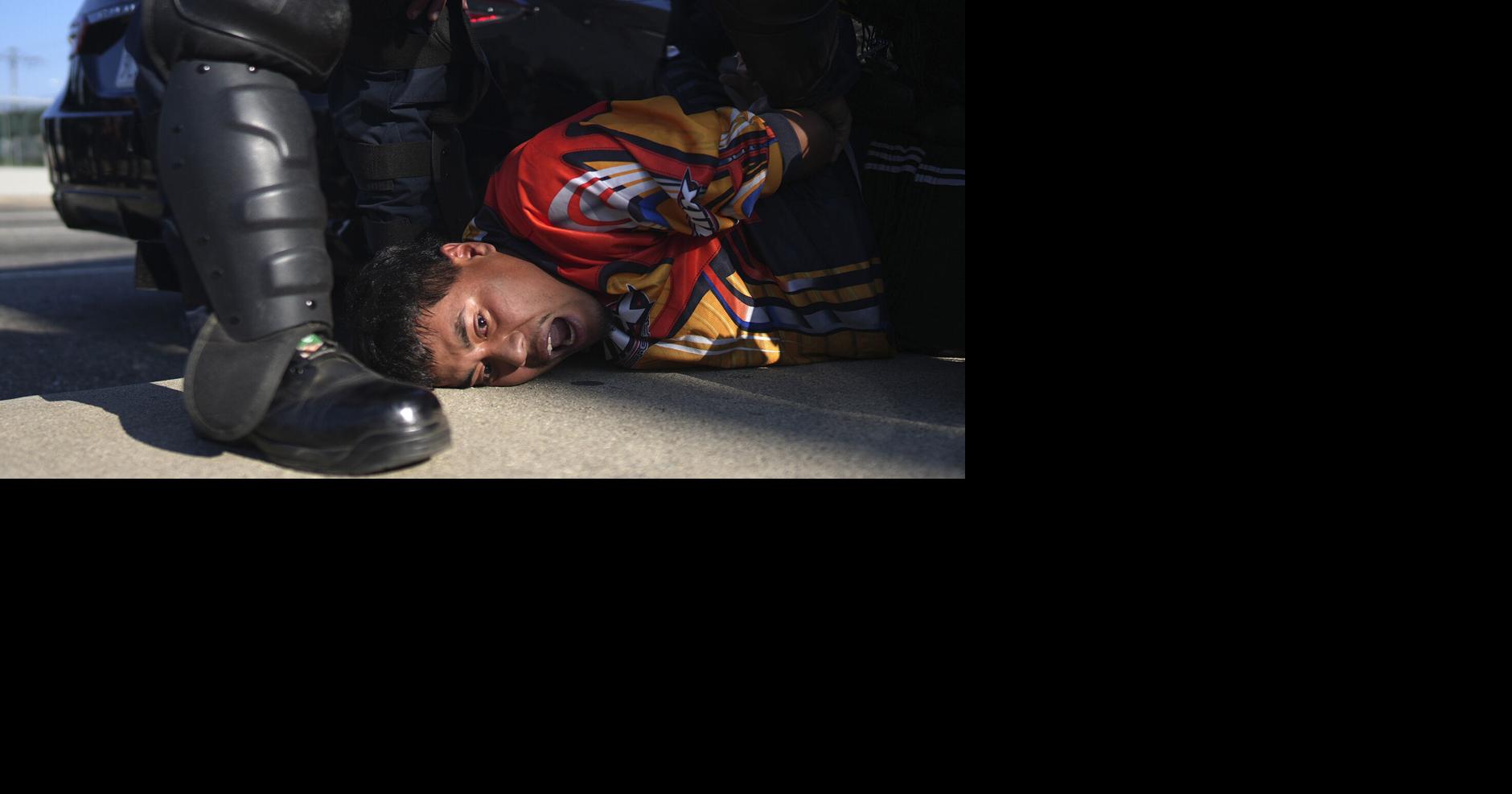 Police detain more than 20 people on first night of curfew in downtown Los ...