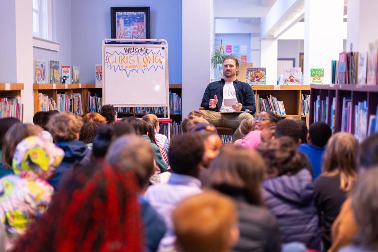Chris Reading to Cville Elementary School Kids.jpg
