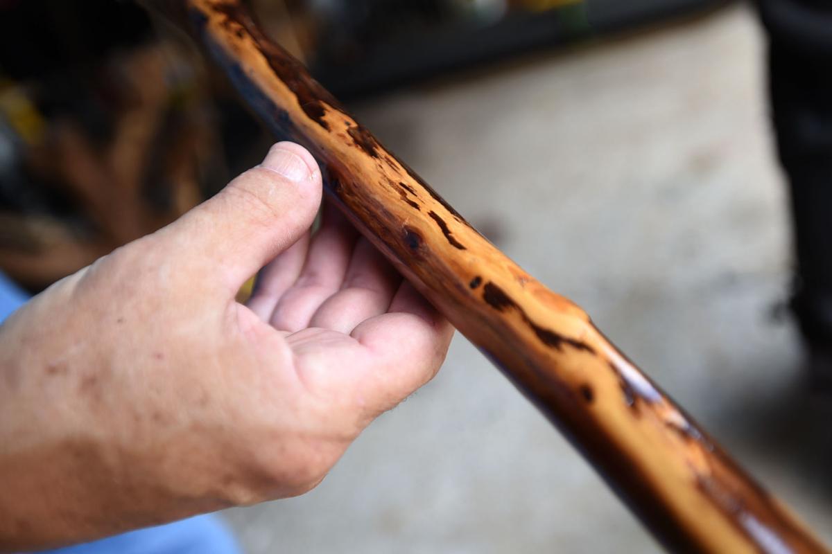 From tree limbs to hikers' hands: Craftsman sells walking sticks at