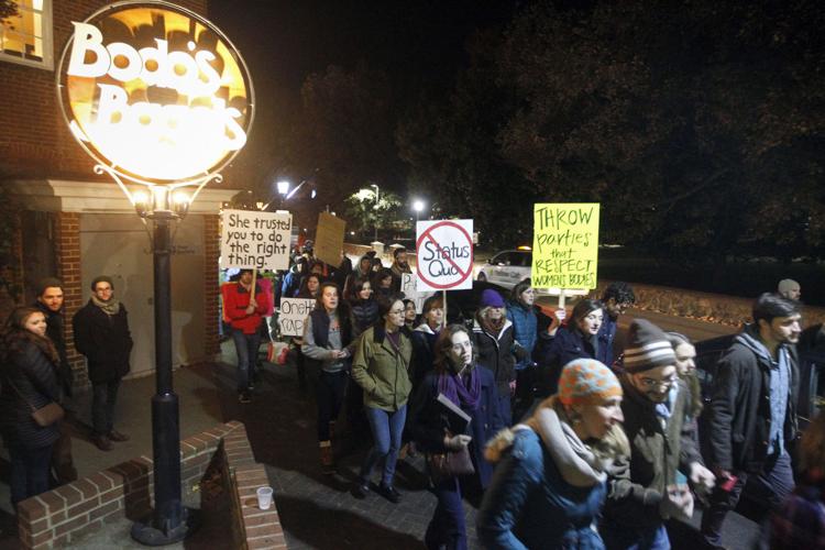 Hundreds protest at UVa; student says memorial to victims vandalized