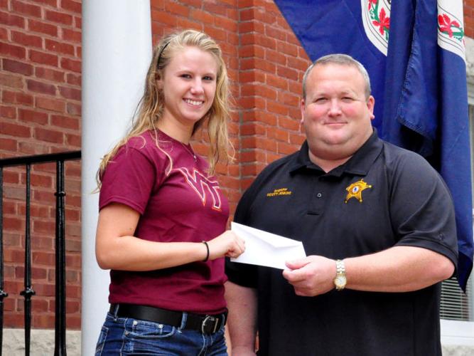Two graduates get scholarships toward criminal justice degrees