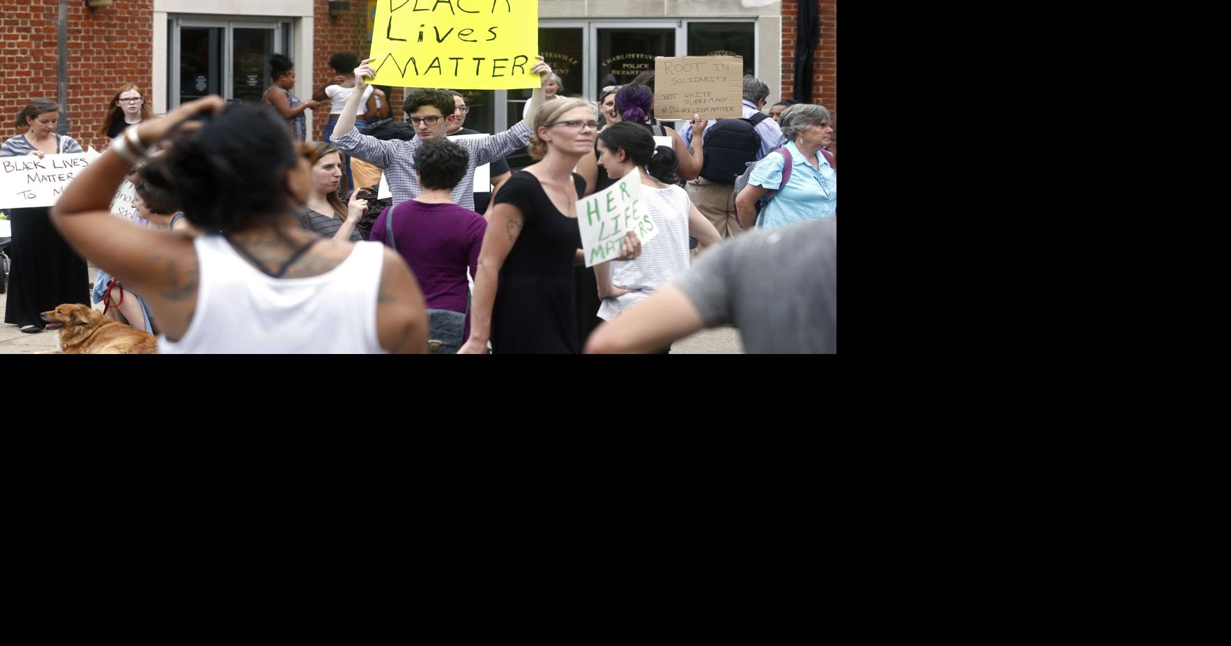 Protest at city police department seeks unity in addressing racial divide