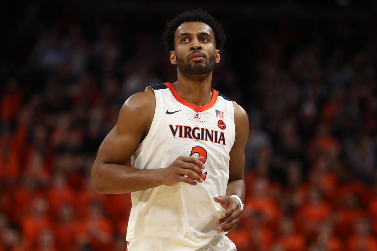 Virginia basketball back on court, honors shooting victims