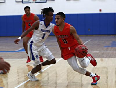 Orange County Boys Basketball Team Rolls Past Madison To Continue