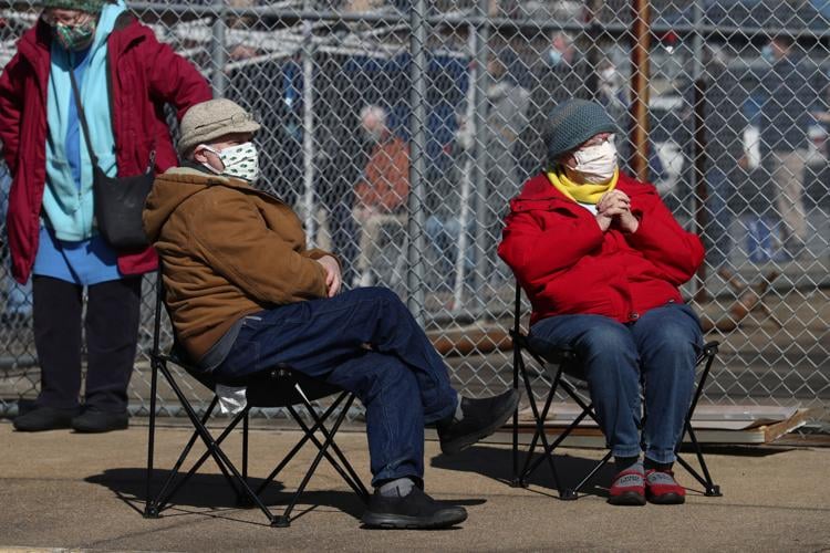 Vaccine recipients wait in line for hours as registration glitch causes