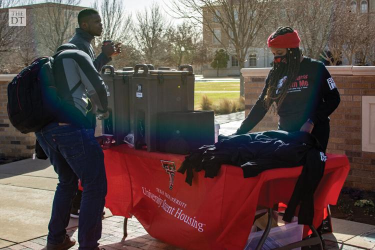 Hospitality is provided on a windy and chilly day on campus