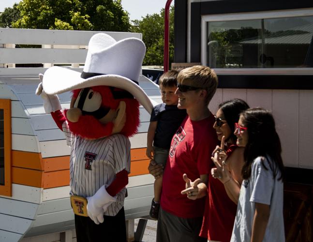 Raider Red poses with childern