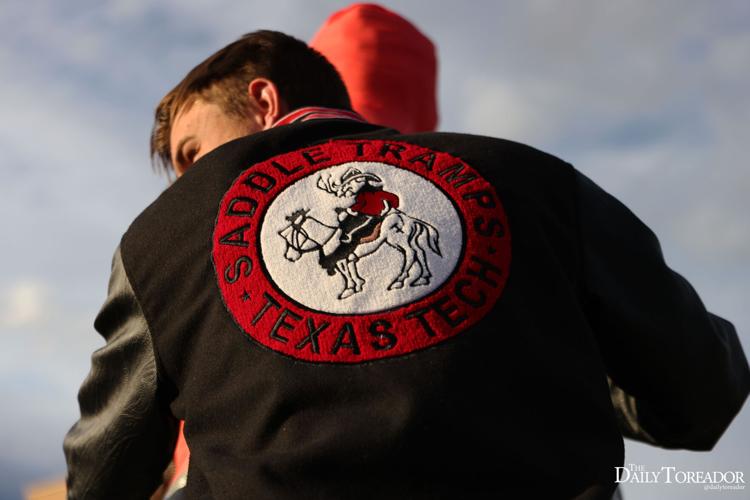Saddle Tramps wrap Will Rogers and Soapsuds statue in preparation for