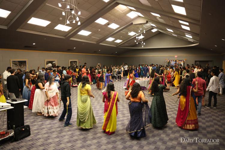 Garba, Dandiya attendees dance together