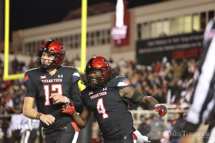 Shough and Thompson laugh after a touchdown