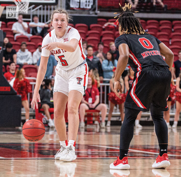 McKinney calls a play while dribbling