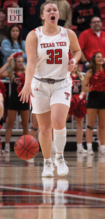 Veitenheimer drives the ball down the court