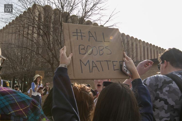 Students listen to Sister Cindy and Brother Jed outside the Student