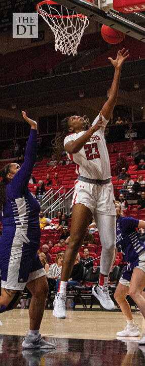 Faye shoots a layup after making a move around her defender