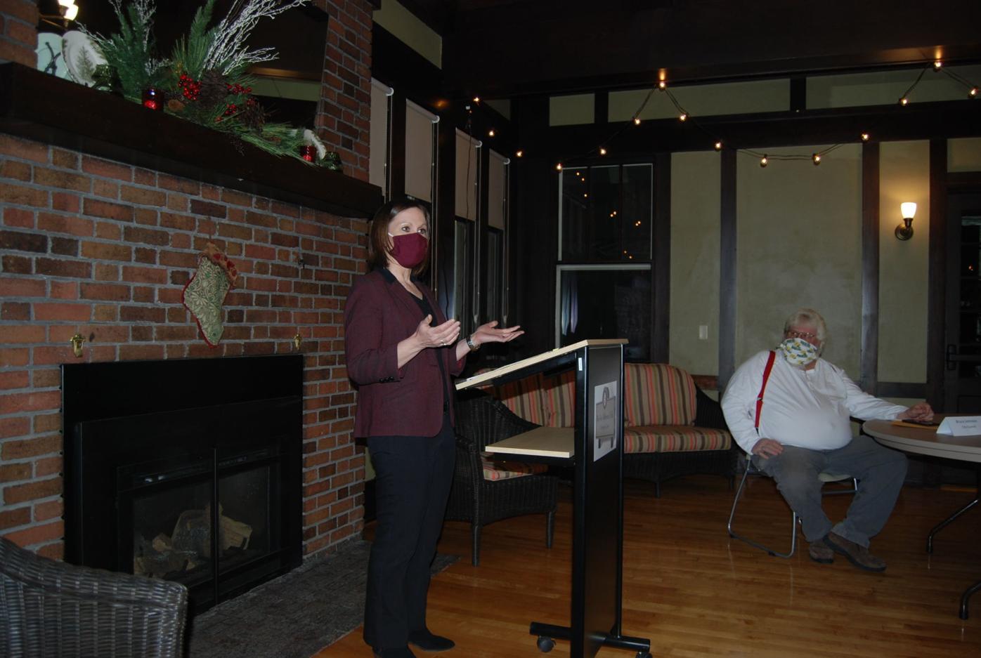 Houseman Lemire at the podium