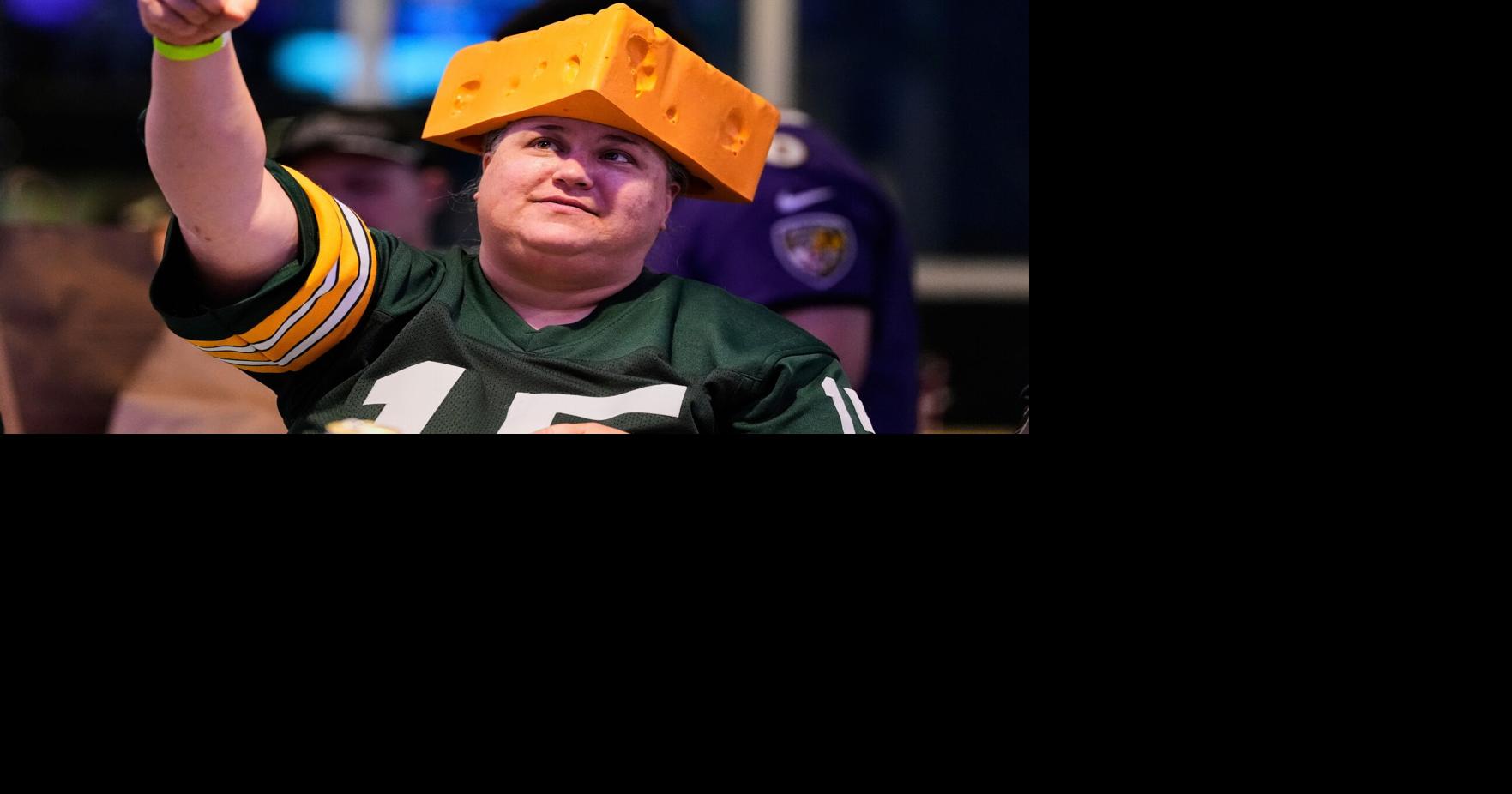 The cheesehead hat is a sunny nod to America's 'Hold my beer' exuberance