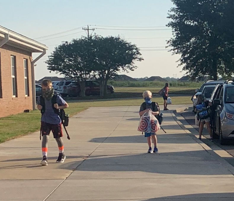 Students have temperatures checked, wear masks as Limestone schools