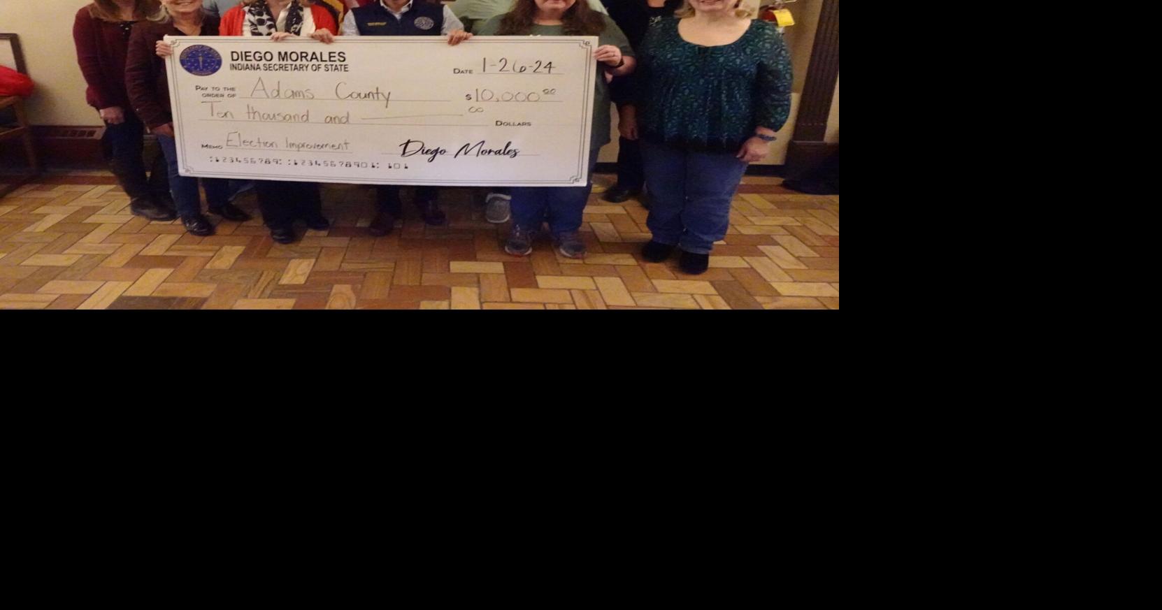 Secretary of State appears here with check for county | News ...