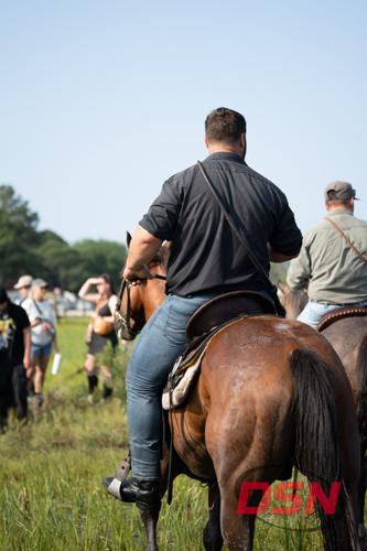 Saltwater Cowboys riding away from the crowd on the trail.jpg