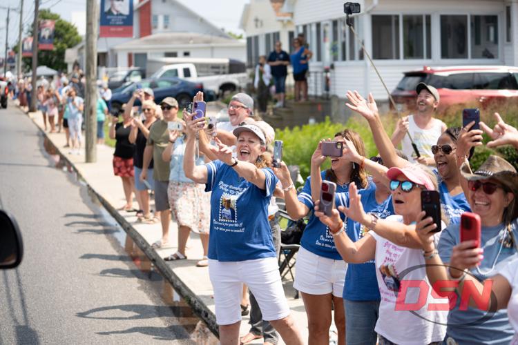 Crowds take photos during the pony parade