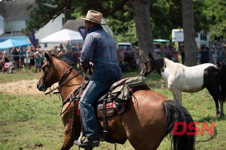 A Saltwater Cowboy rounds up the ponies at the carnival grounds