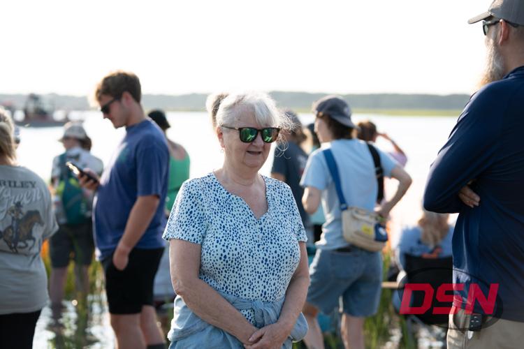 Woman in sunglasses smiling in the crowd.jpg