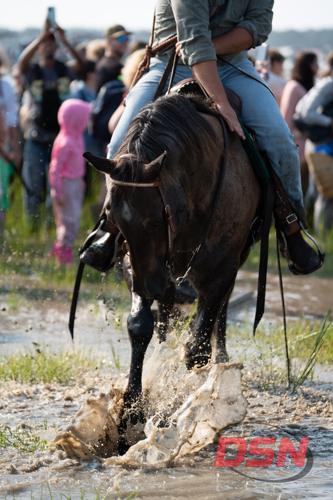 Saltwater Cowboy's horse kicking up a big splash.jpg