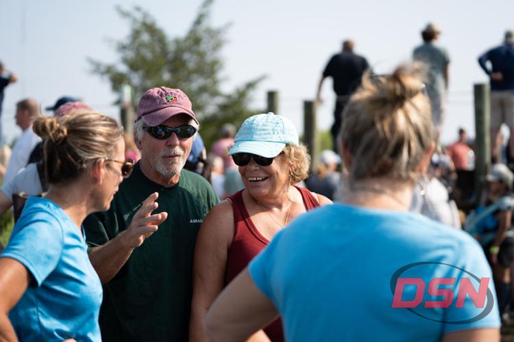 Group of spectators chatting and laughing together.jpg