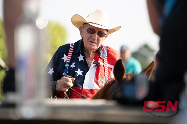 Saltwater Cowboy in patriotic shirt and cowboy hat on his horse.jpg
