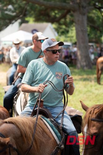 A Saltwater Cowboy rounds up the ponies at the carnival grounds