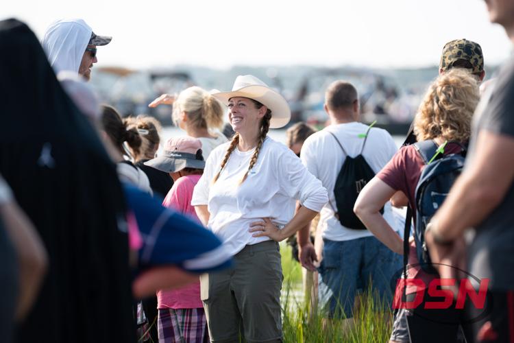 Woman in a cowboy hat laughing with the crowd.jpg