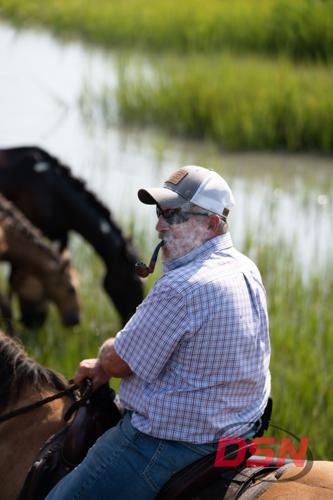 Saltwater Cowboy smoking a pipe on horseback by the marsh.jpg