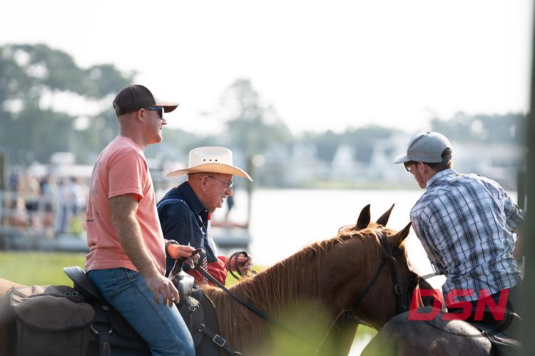 Saltwater Cowboys on horseback chatting before the swim.jpg