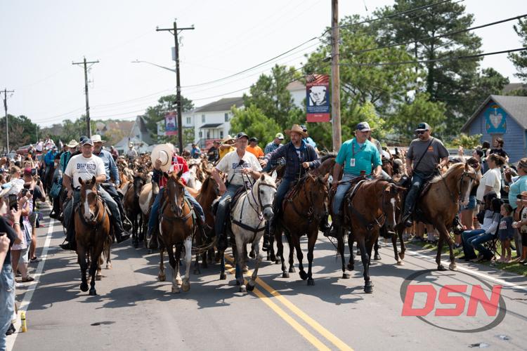 Saltwater Cowboys lead the parade from the marsh to the carnival grounds