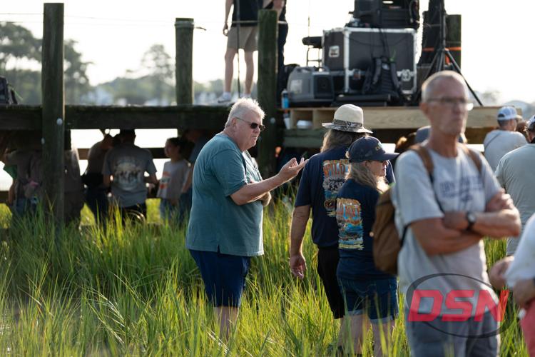 Spectators wearing Wild Pony Swim shirts in the marsh.jpg