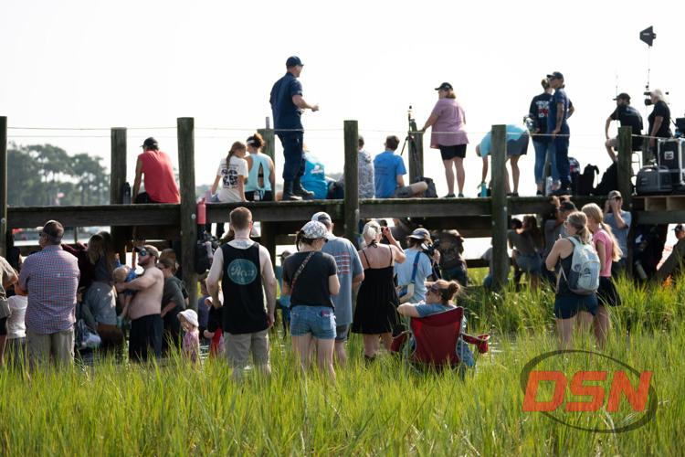 Large crowd gathered on and under the dock.jpg
