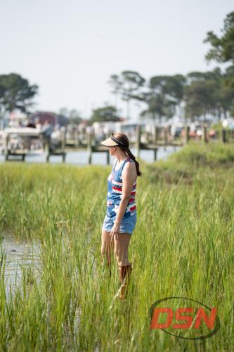 Woman in patriotic tank top standing in the tall marsh grass.jpg
