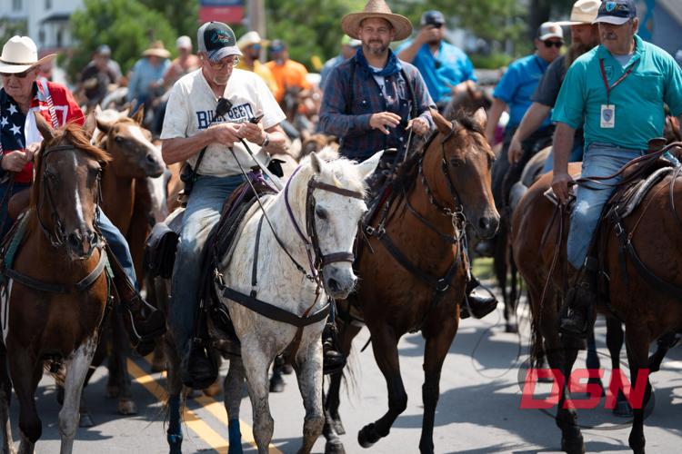 Saltwater Cowboys lead the parade from the marsh to the carnival grounds