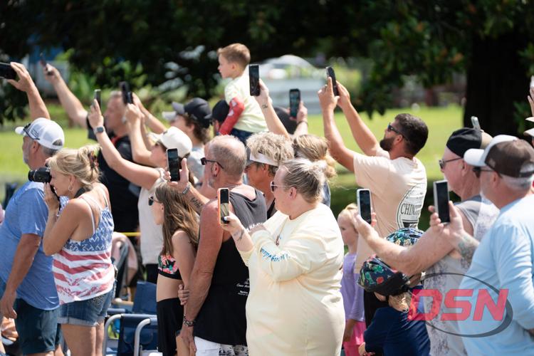 Crowds take photos during the pony parade